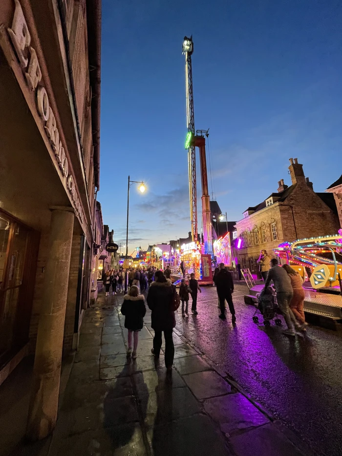Walking through the Mid-Lent Fair at night on Broad Street, Stamford